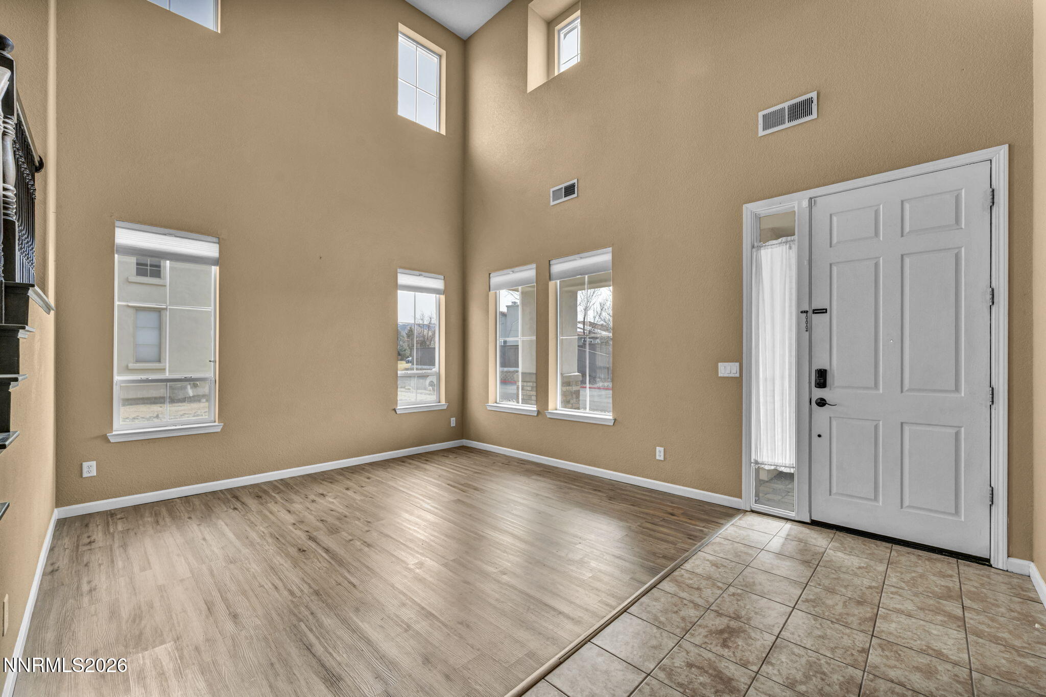 475 Parade Drive Reno, NV 89521 - Photo 47 of 113 a view of an empty room with glass door and wooden floor