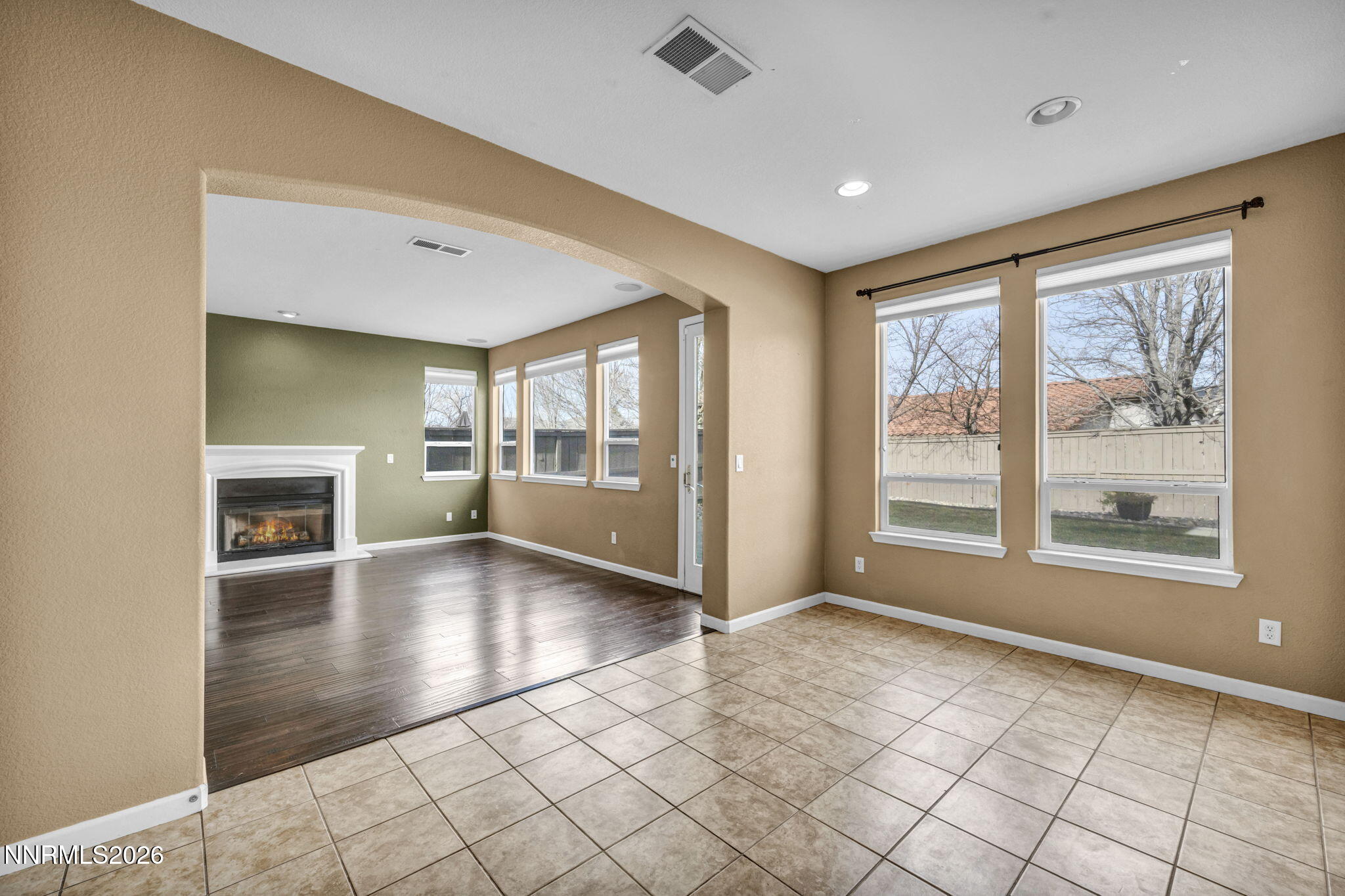 475 Parade Drive Reno, NV 89521 - Photo 58 of 113 a view of an empty room with a window and wooden floor