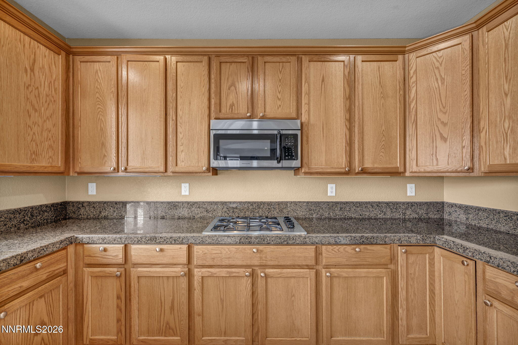 475 Parade Drive Reno, NV 89521 - Photo 69 of 113 a kitchen with stainless steel appliances granite countertop white cabinets a sink and dishwasher