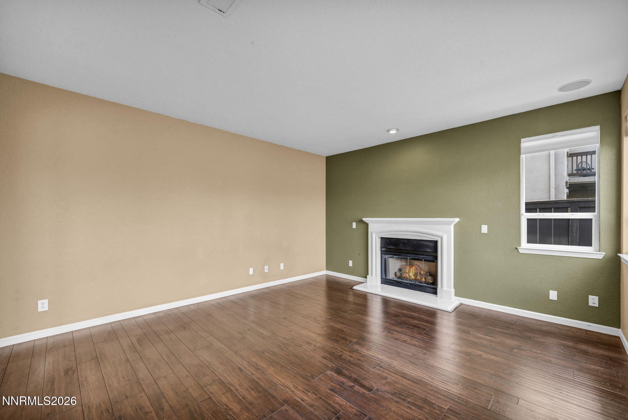475 Parade Drive Reno, NV 89521 - Photo 71 of 113 a view of an empty room with a fireplace and a window
