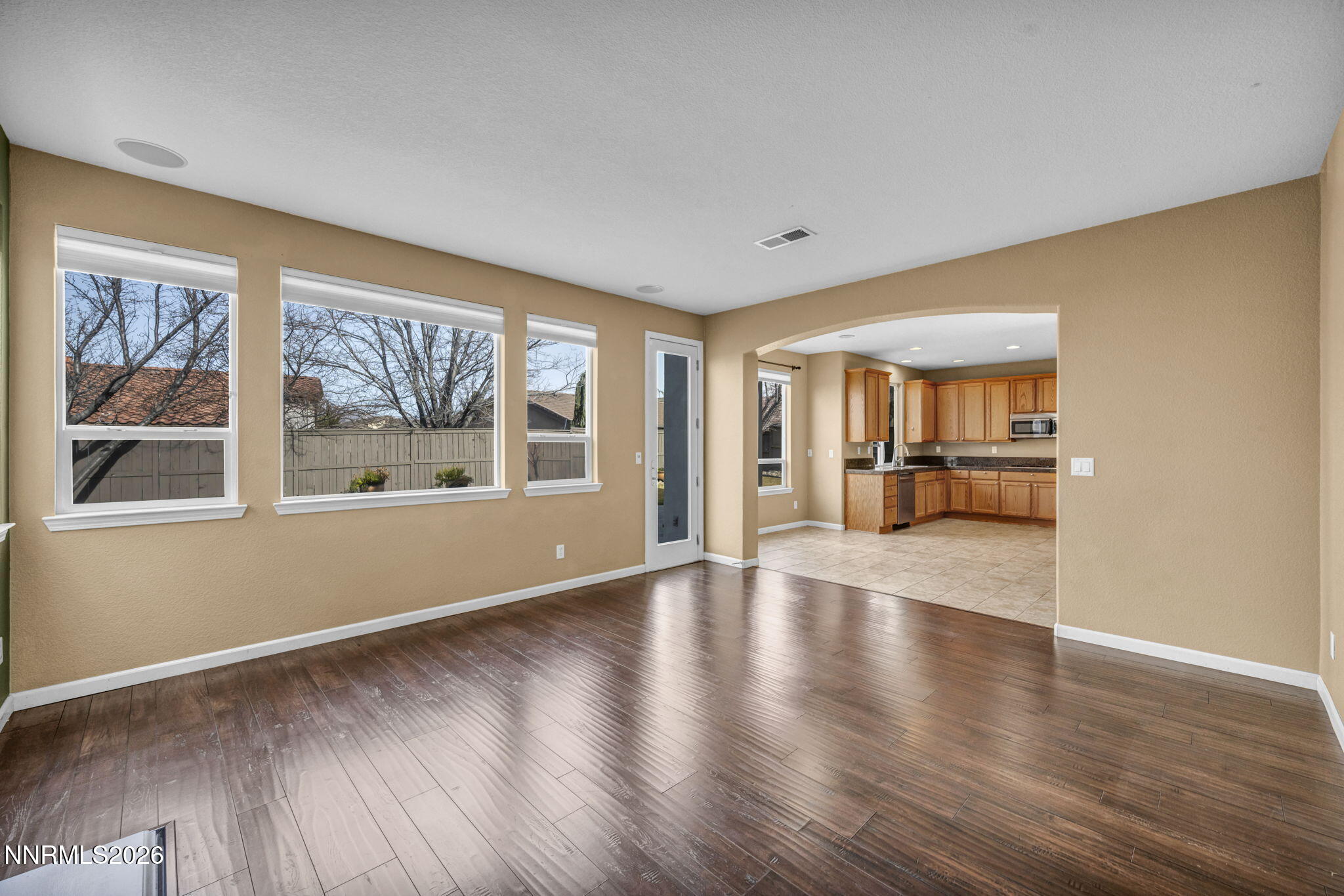 475 Parade Drive Reno, NV 89521 - Photo 73 of 113 a view of empty room with wooden floor and fan