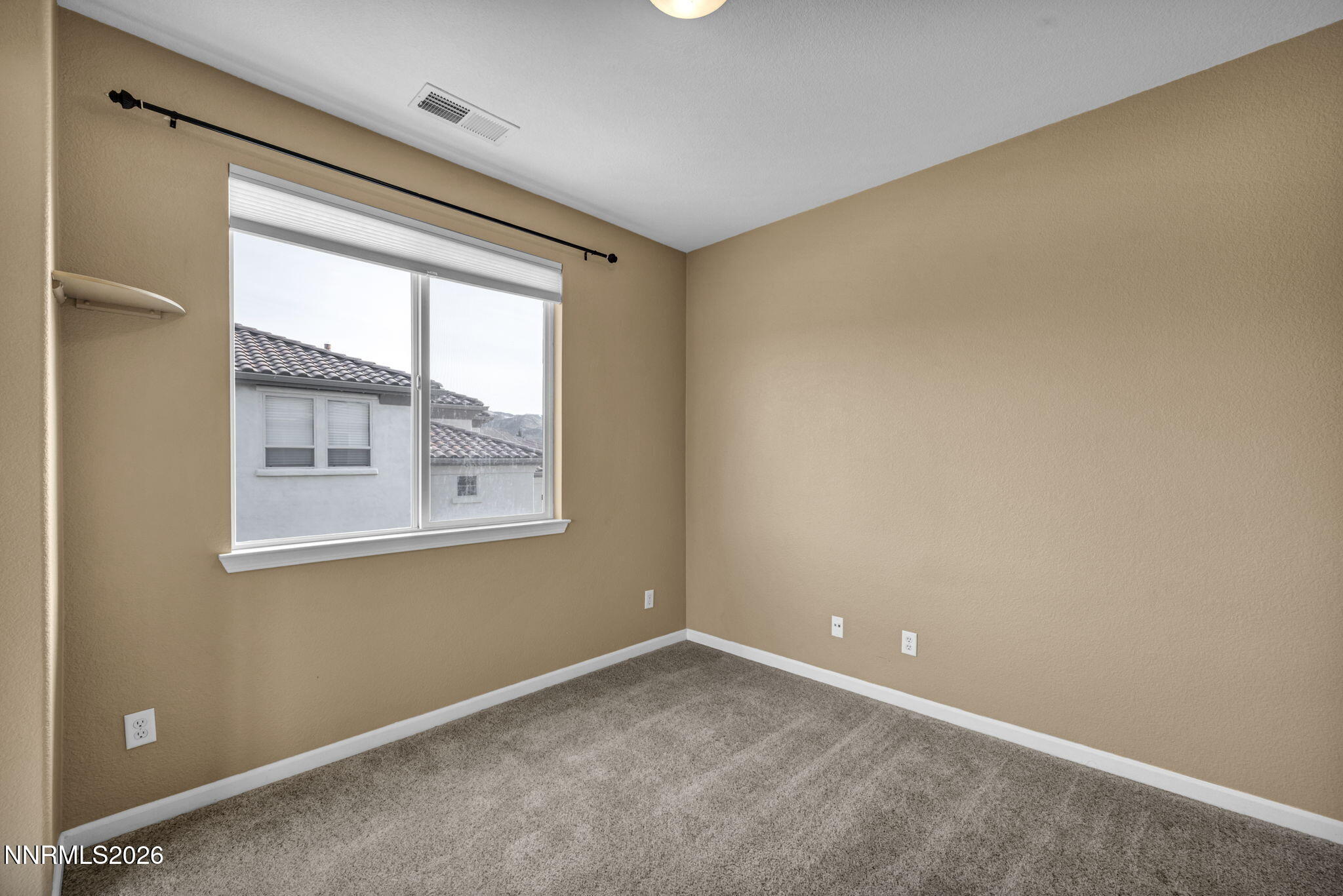 475 Parade Drive Reno, NV 89521 - Photo 78 of 113 a view of an empty room with a window