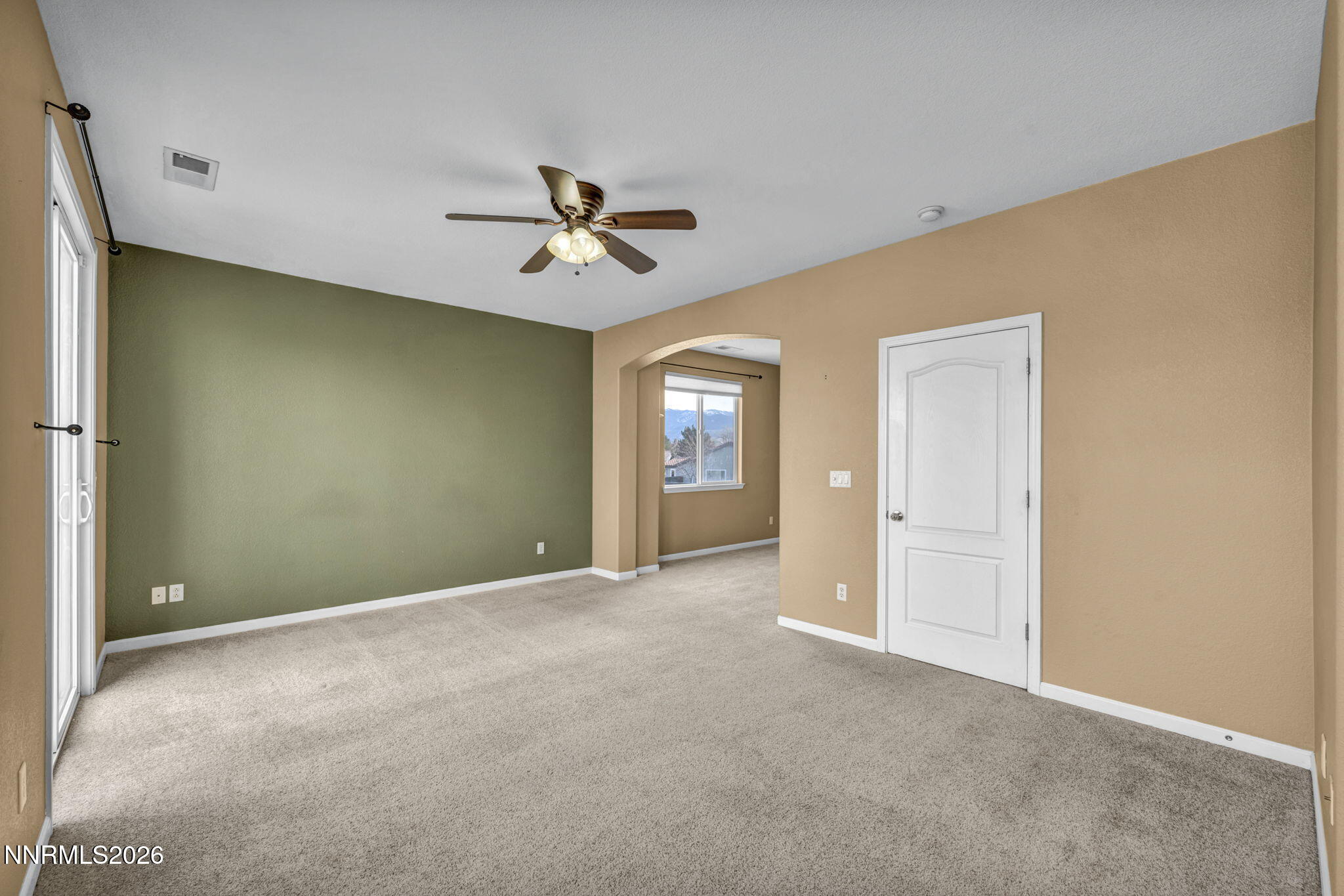 475 Parade Drive Reno, NV 89521 - Photo 85 of 113 a view of empty room with windows and ceiling fan