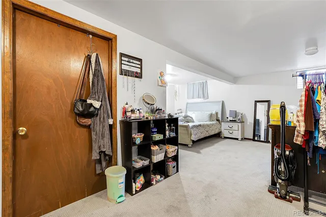 a bed room with furniture and a window