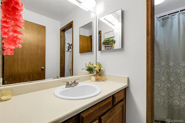 a bathroom with a sink and a mirror