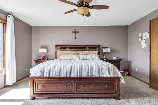 a bedroom with a bed and window