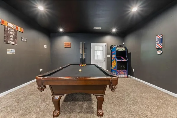 a bed room with a bed and a television