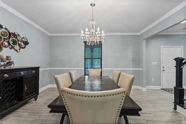 a kitchen with stainless steel appliances kitchen island granite countertop a stove a sink and a microwave