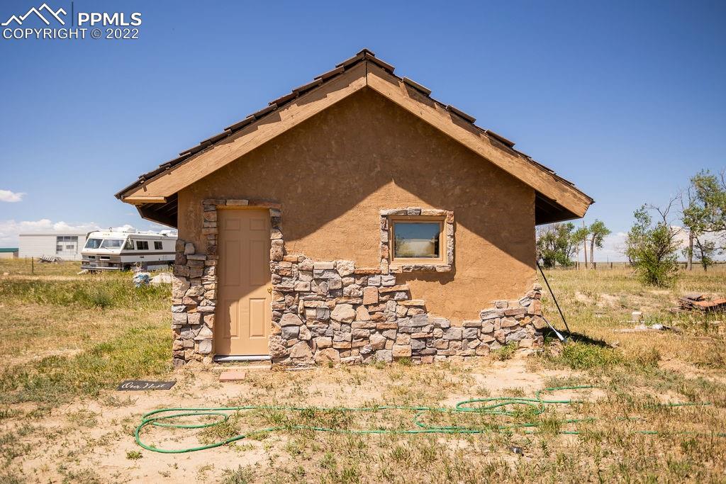30915 Washington Road Calhan, CO 80808 - Photo 16 of 29 a view of a house with a yard