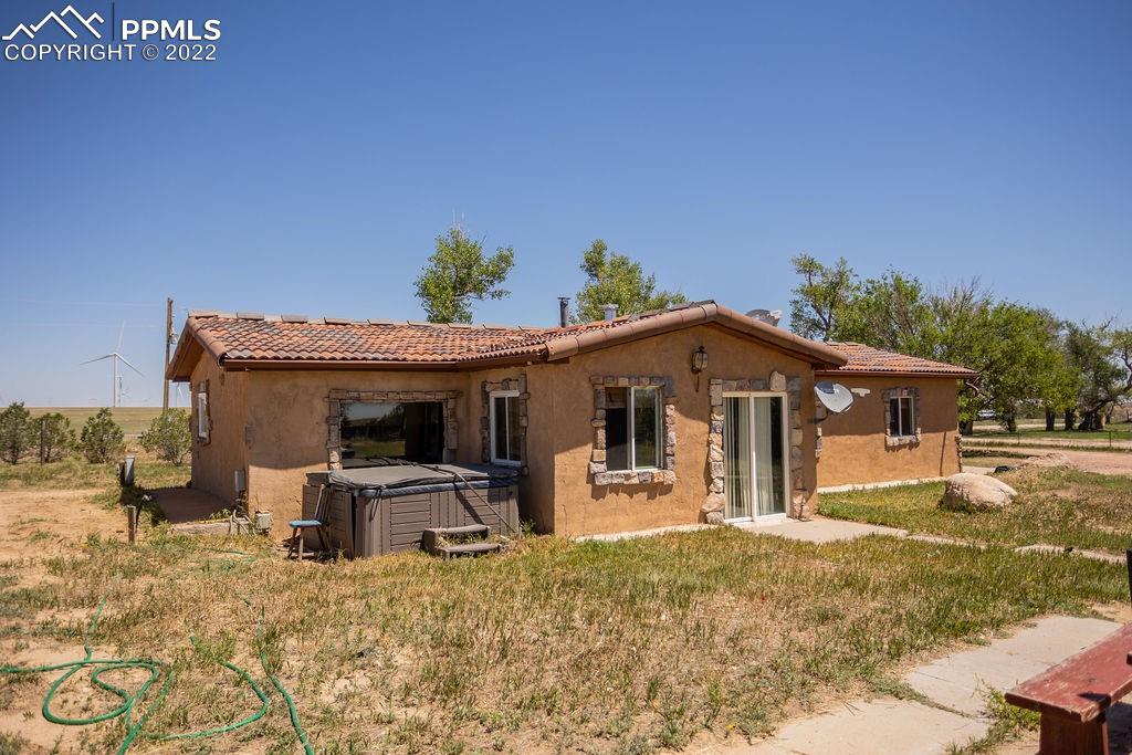 30915 Washington Road Calhan, CO 80808 - Photo 20 of 29 a front view of a house with a yard