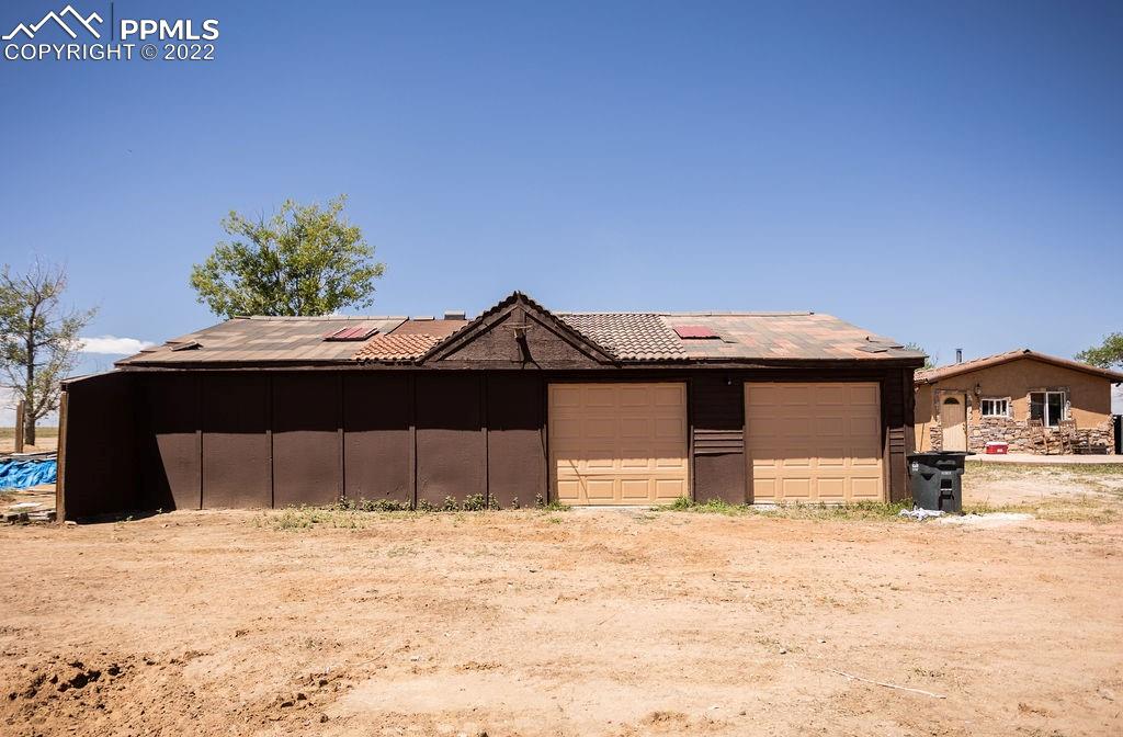 30915 Washington Road Calhan, CO 80808 - Photo 21 of 29 a house that has a tree in front of it