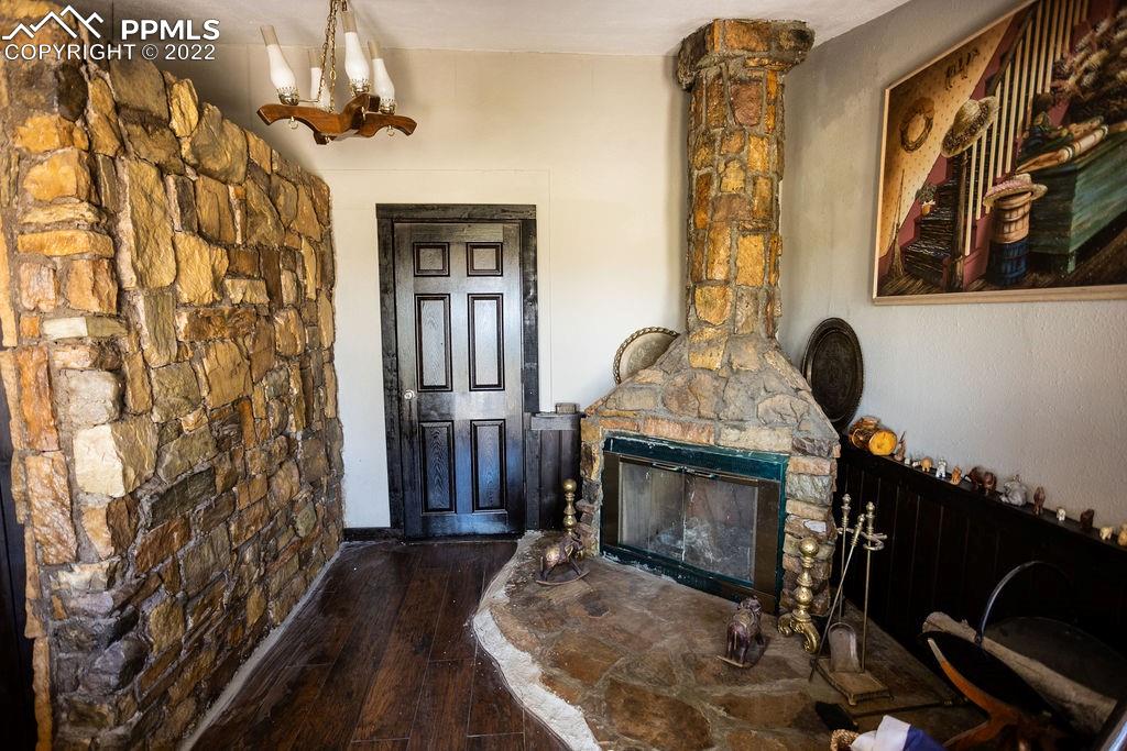30915 Washington Road Calhan, CO 80808 - Photo 10 of 29 a living room with furniture and a fireplace