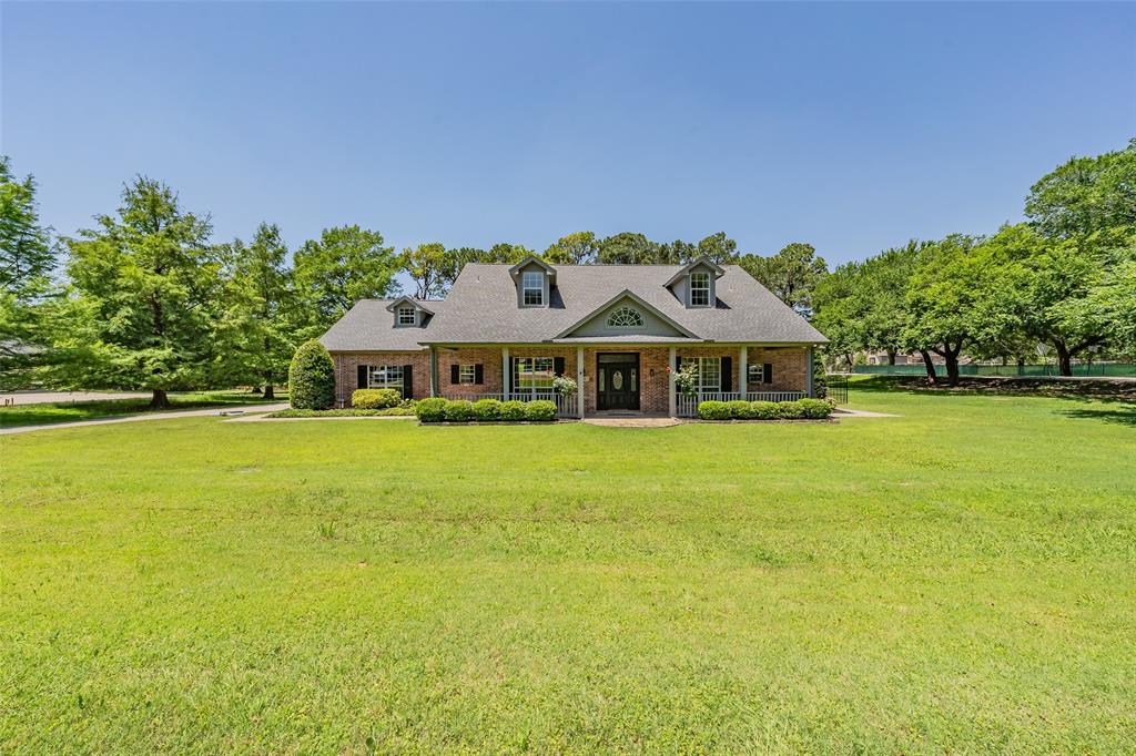 1200 Mount Gilead Road Keller, TX 76262 - Photo 2 of 38 a front view of a house with a garden