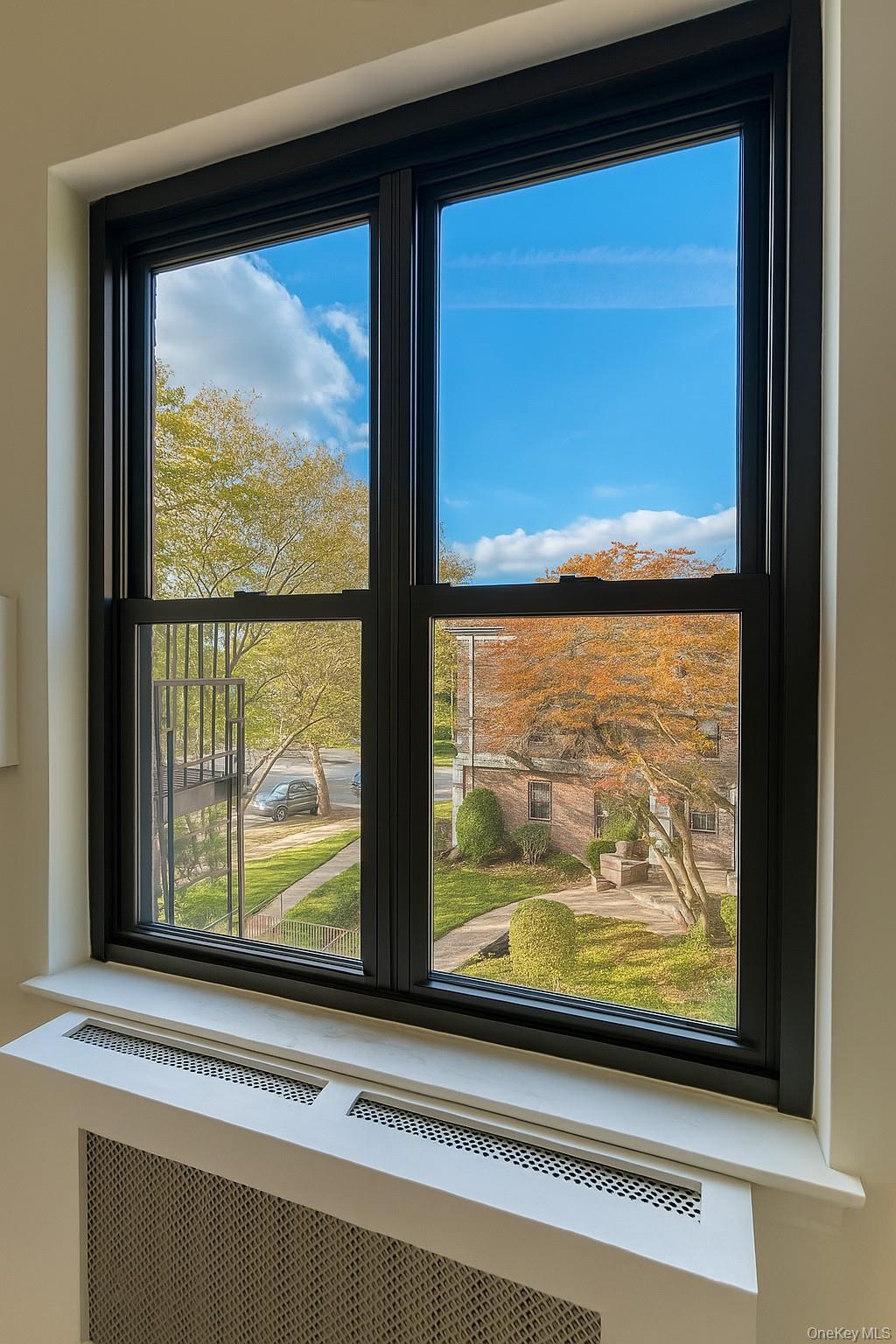 7 Terrace, Unit 3H Great Neck, NY 11021 - Photo 14 of 37 a view of a living room with a large window