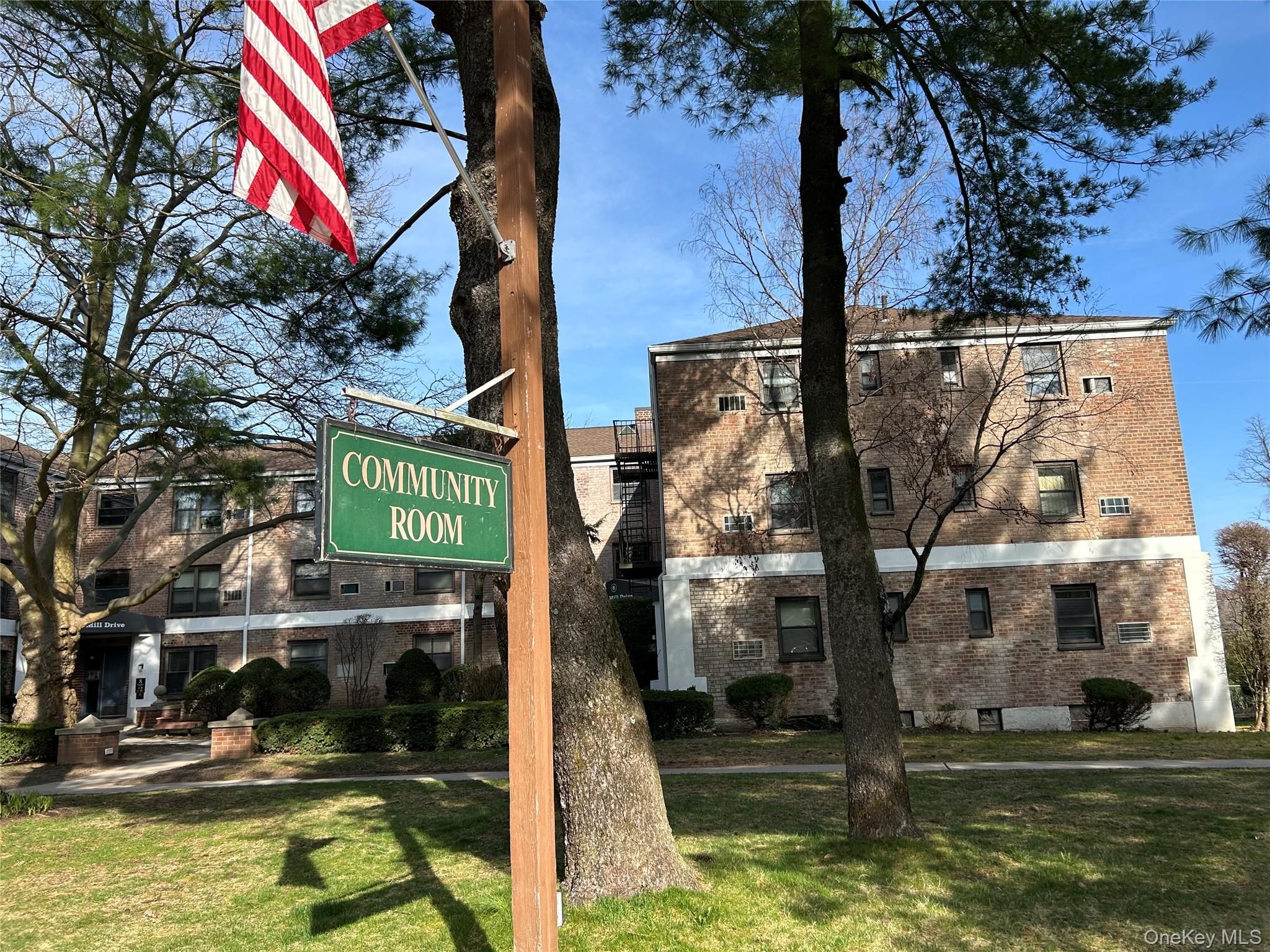 7 Terrace, Unit 3H Great Neck, NY 11021 - Photo 26 of 37 a swimming pool with outdoor seating