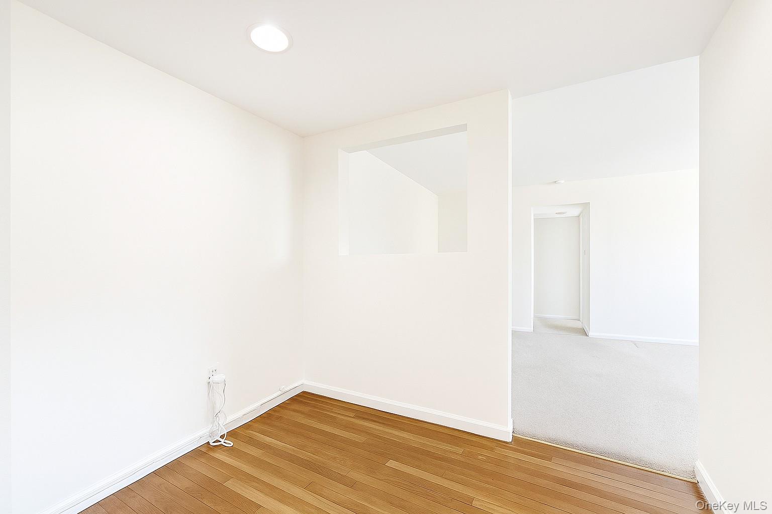 7 Terrace, Unit 3H Great Neck, NY 11021 - Photo 7 of 37 a view of a room with wooden floor