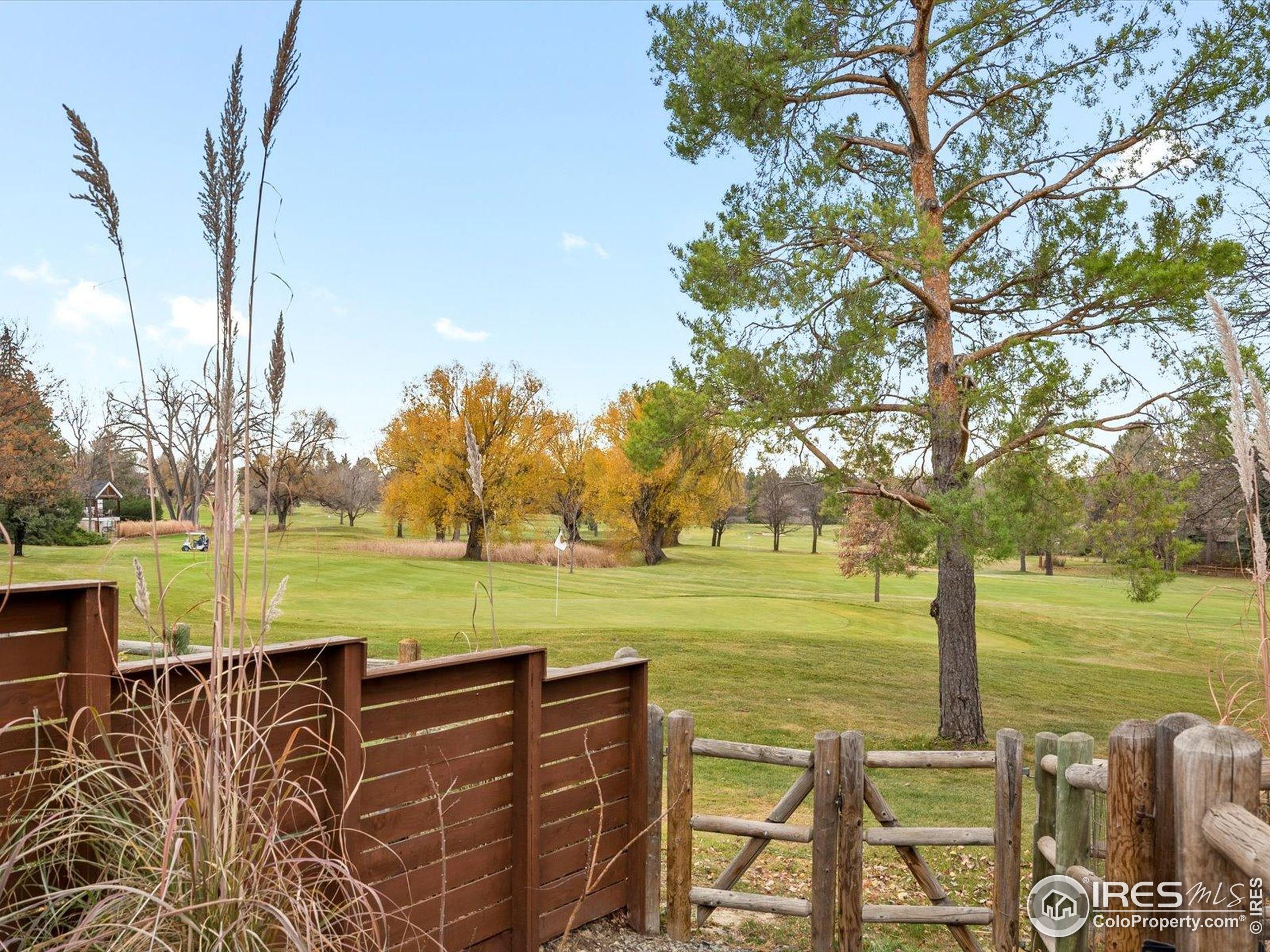 6972 Roaring Fork Trail Boulder, CO 80301 - Photo 33 of 35 a view of a lake with an outdoor space