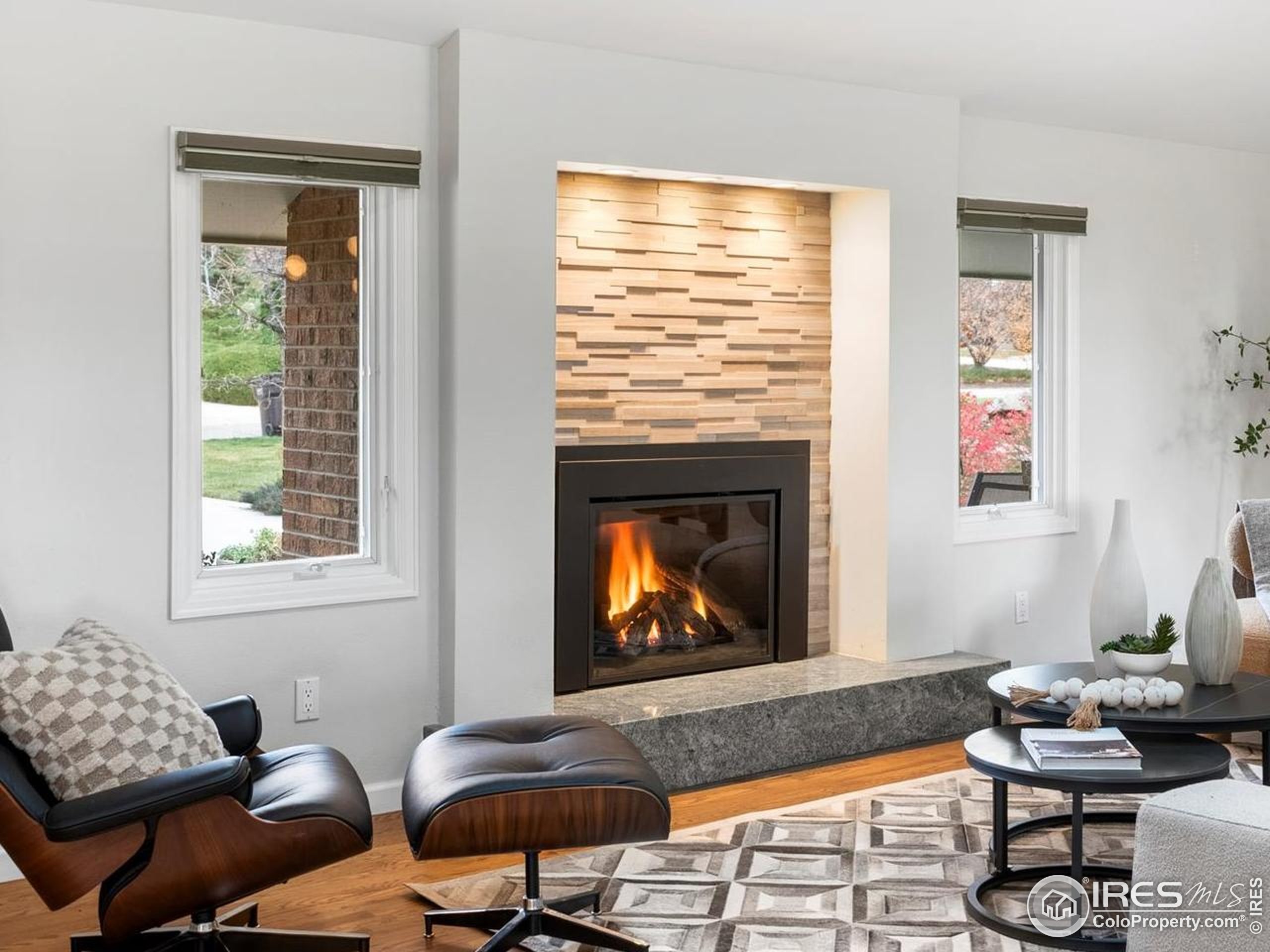 6972 Roaring Fork Trail Boulder, CO 80301 - Photo 5 of 35 a living room with furniture and a fireplace