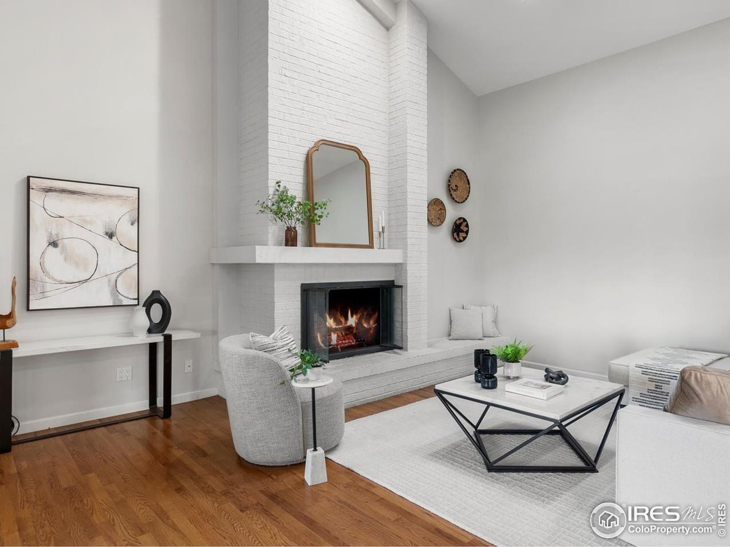 6972 Roaring Fork Trail Boulder, CO 80301 - Photo 8 of 35 a living room with furniture and a fireplace