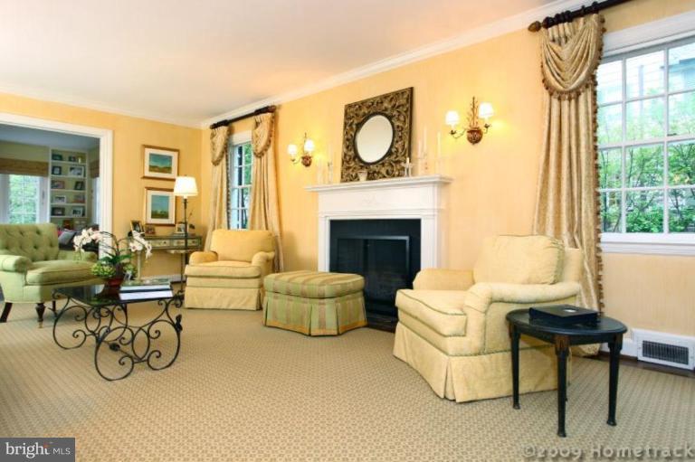 213 Tunbridge Road Baltimore, MD 21212 - Photo 2 of 24 a living room with furniture a fireplace and a large window