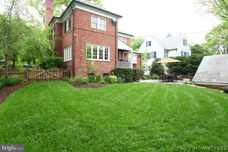 213 Tunbridge Road Baltimore, MD 21212 - Photo 16 of 24 a front view of a house with a yard and trees