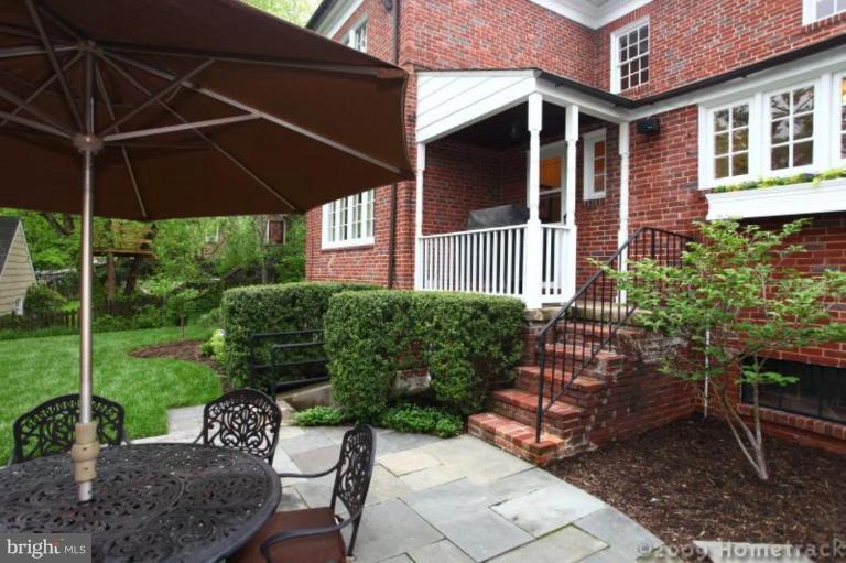213 Tunbridge Road Baltimore, MD 21212 - Photo 17 of 24 a view of a chair and table in the patio and a garden