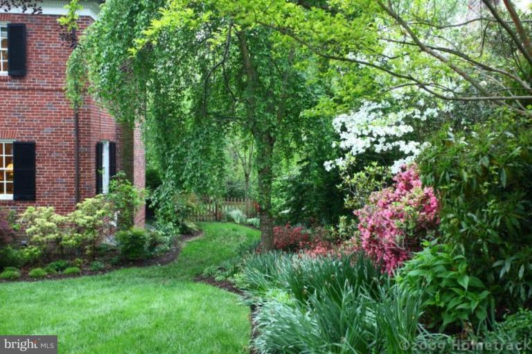 213 Tunbridge Road Baltimore, MD 21212 - Photo 19 of 24 a view of a house with a flower garden