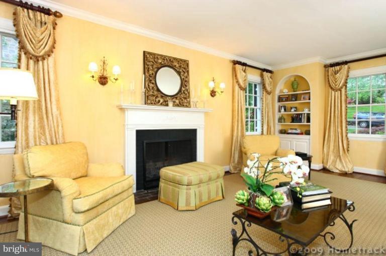 213 Tunbridge Road Baltimore, MD 21212 - Photo 3 of 24 a living room with furniture fireplace and a large window