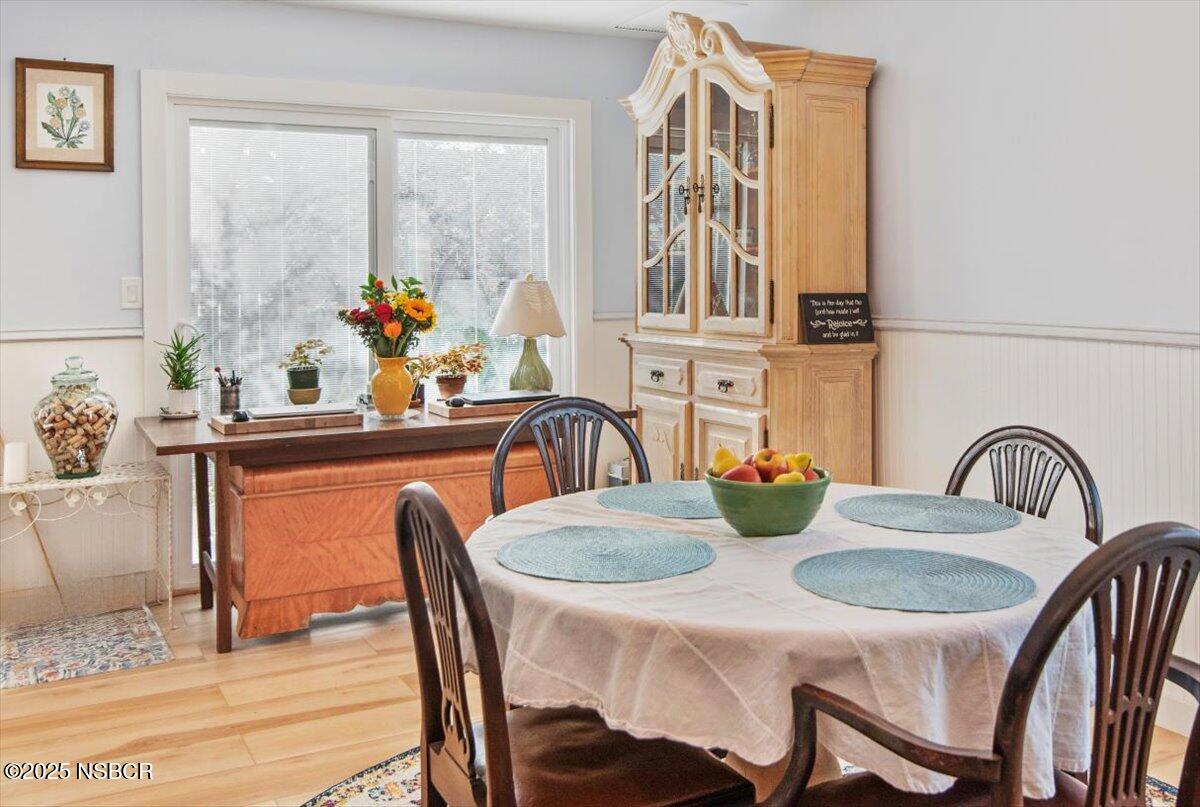 335 South F Street Lompoc, CA 93436 - Photo 12 of 44 a dining table with chairs and table