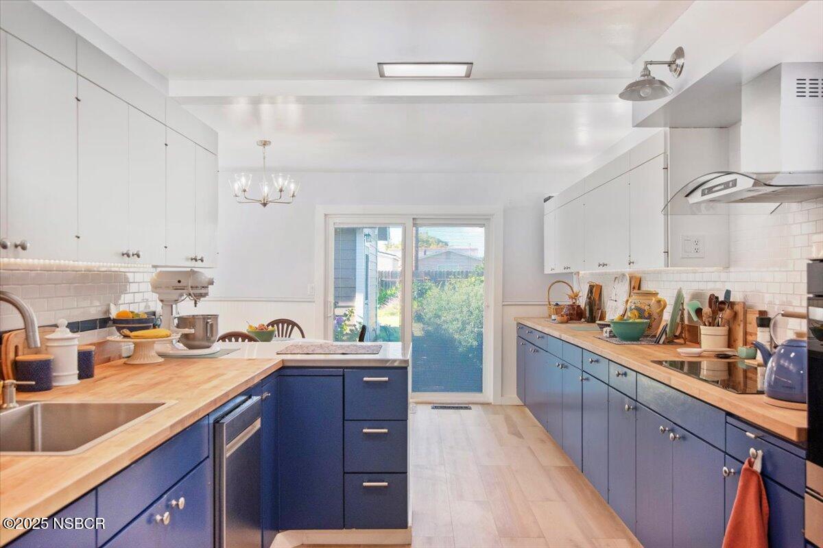 335 South F Street Lompoc, CA 93436 - Photo 14 of 44 a kitchen with lots of counter top space and a sink