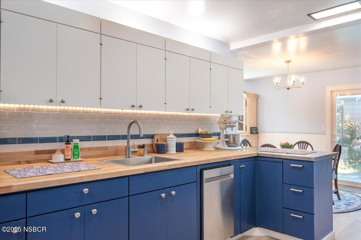 335 South F Street Lompoc, CA 93436 - Photo 15 of 44 a kitchen with a sink and cabinets