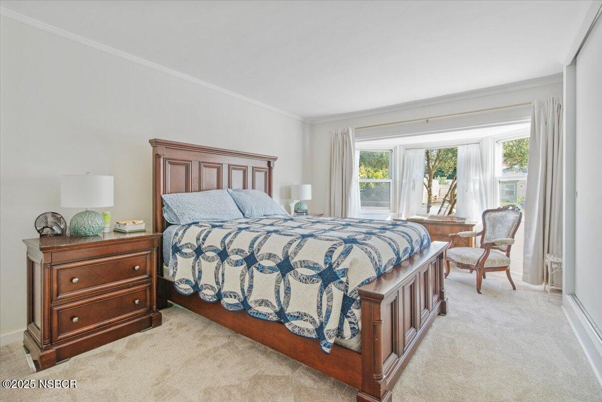 335 South F Street Lompoc, CA 93436 - Photo 19 of 44 a bed sitting in a bedroom next to a window with a dresser