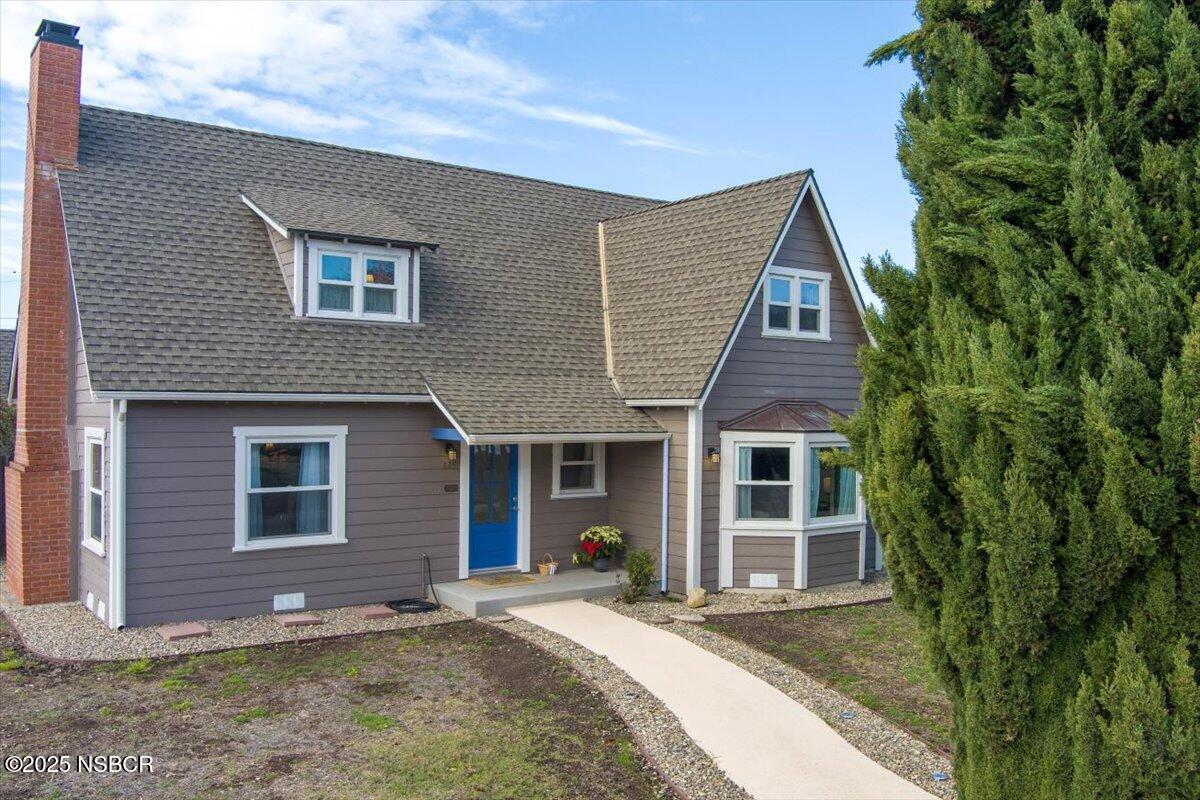 335 South F Street Lompoc, CA 93436 - Photo 2 of 44 a front view of a house with a yard