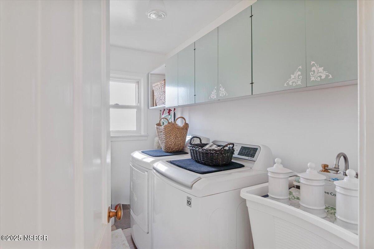 335 South F Street Lompoc, CA 93436 - Photo 24 of 44 a kitchen with a sink and cabinets
