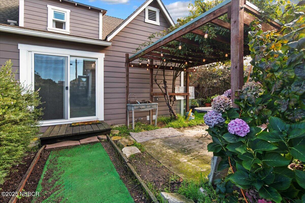 335 South F Street Lompoc, CA 93436 - Photo 33 of 44 a view of a backyard with a garden