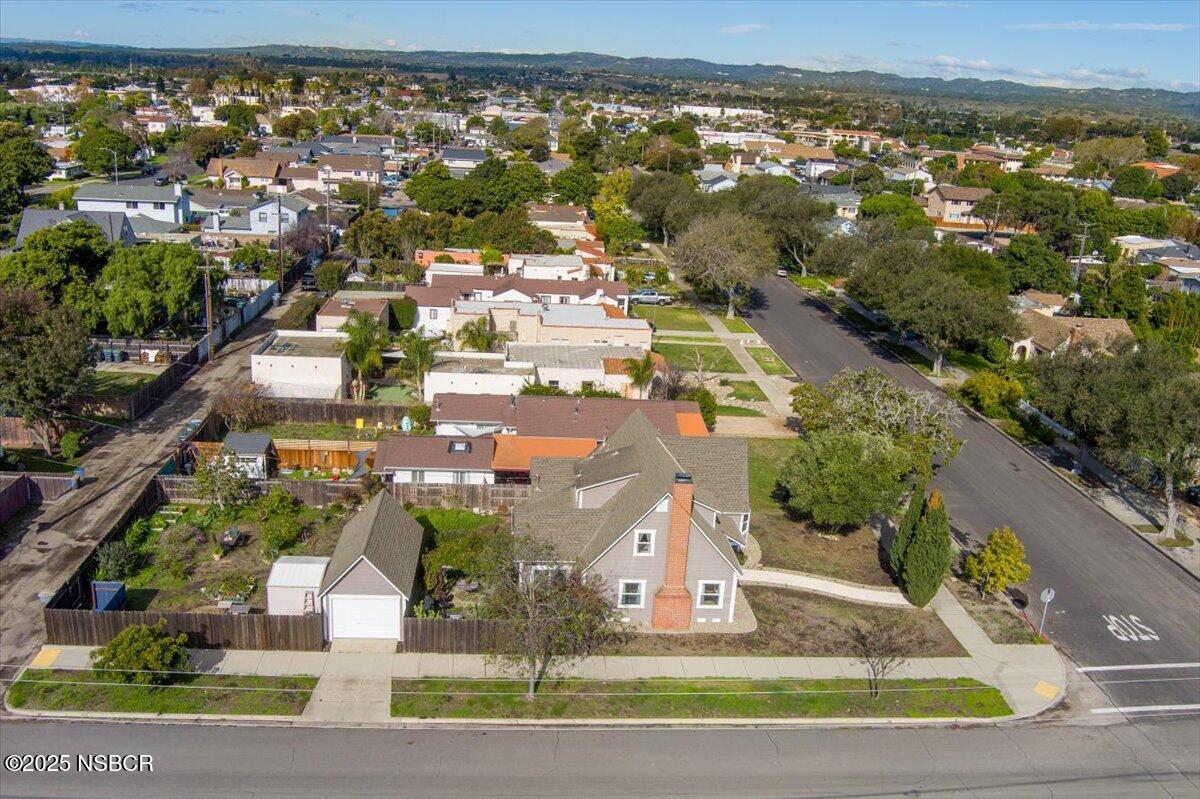 335 South F Street Lompoc, CA 93436 - Photo 44 of 44 an aerial view of residential houses with outdoor space and parking