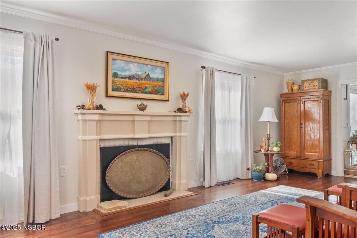 335 South F Street Lompoc, CA 93436 - Photo 7 of 44 a living room with furniture and a fireplace