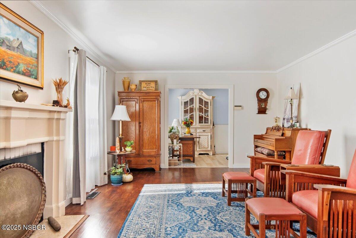 335 South F Street Lompoc, CA 93436 - Photo 10 of 44 a living room with furniture and a fireplace
