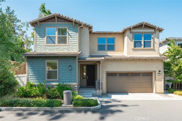 a front view of a house with yard