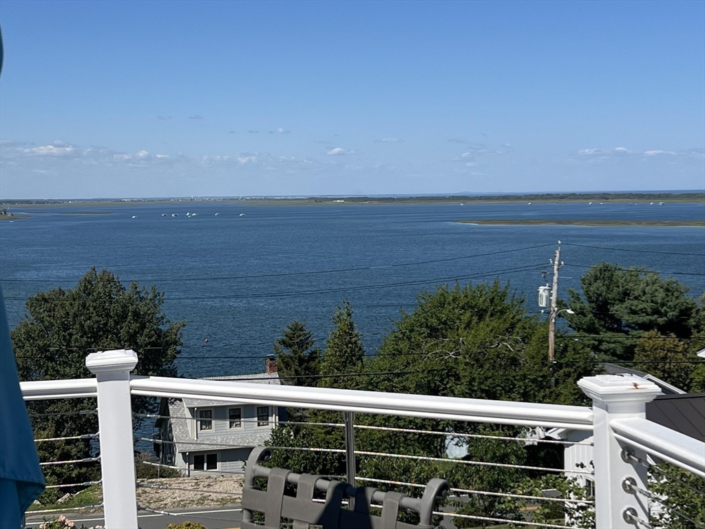 53 Skytop Road Ipswich, MA 01938 - Photo 4 of 7 a view of city from balcony with seating space