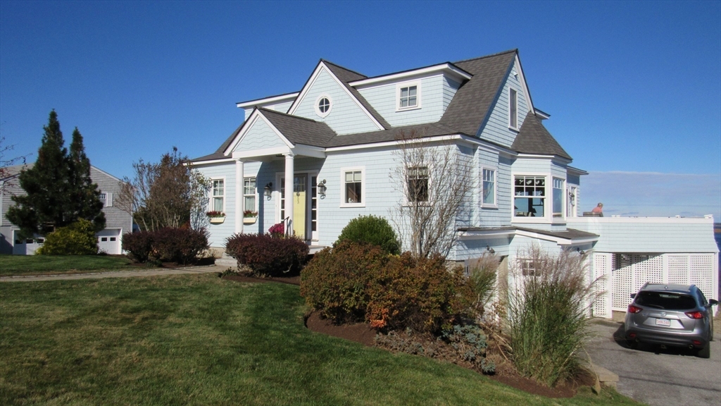 53 Skytop Road Ipswich, MA 01938 - Photo 5 of 7 a front view of a house with a garden