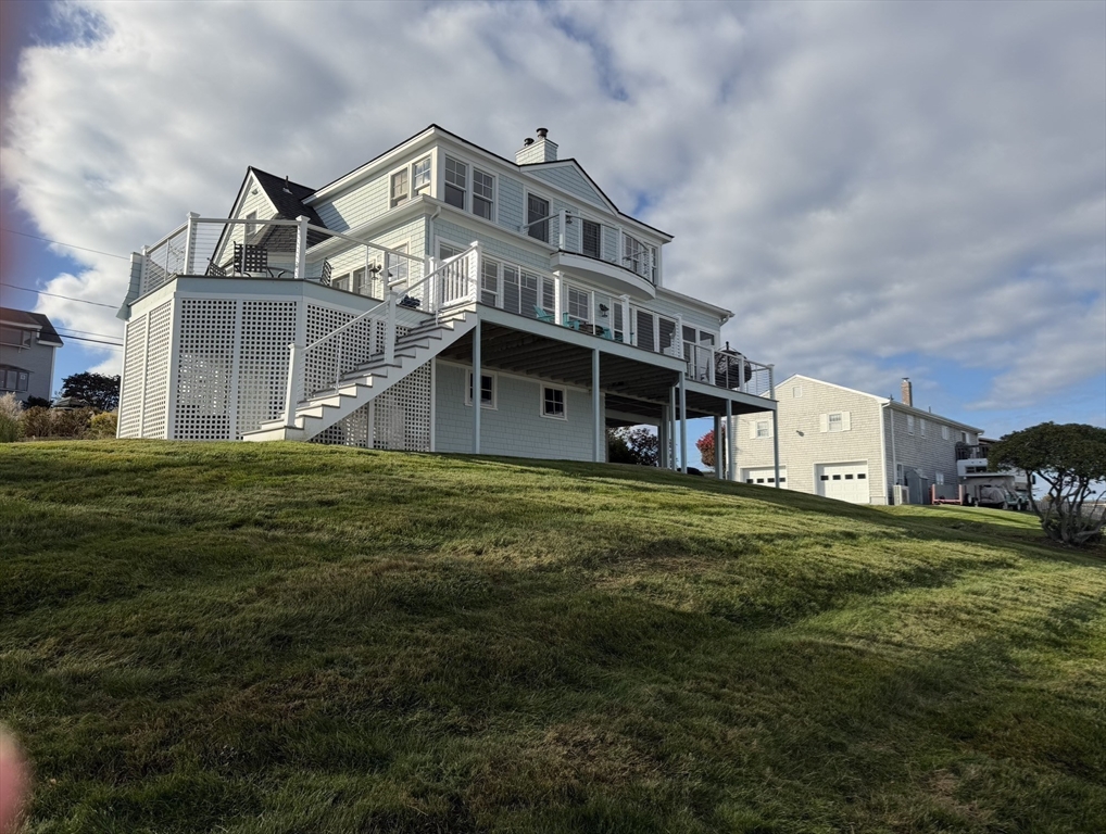 53 Skytop Road Ipswich, MA 01938 - Photo 6 of 7 a front view of a house with a garden
