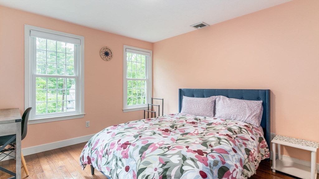 142 Baker Street Walpole, MA 02081 - Photo 35 of 42 a bedroom with a large bed and a window