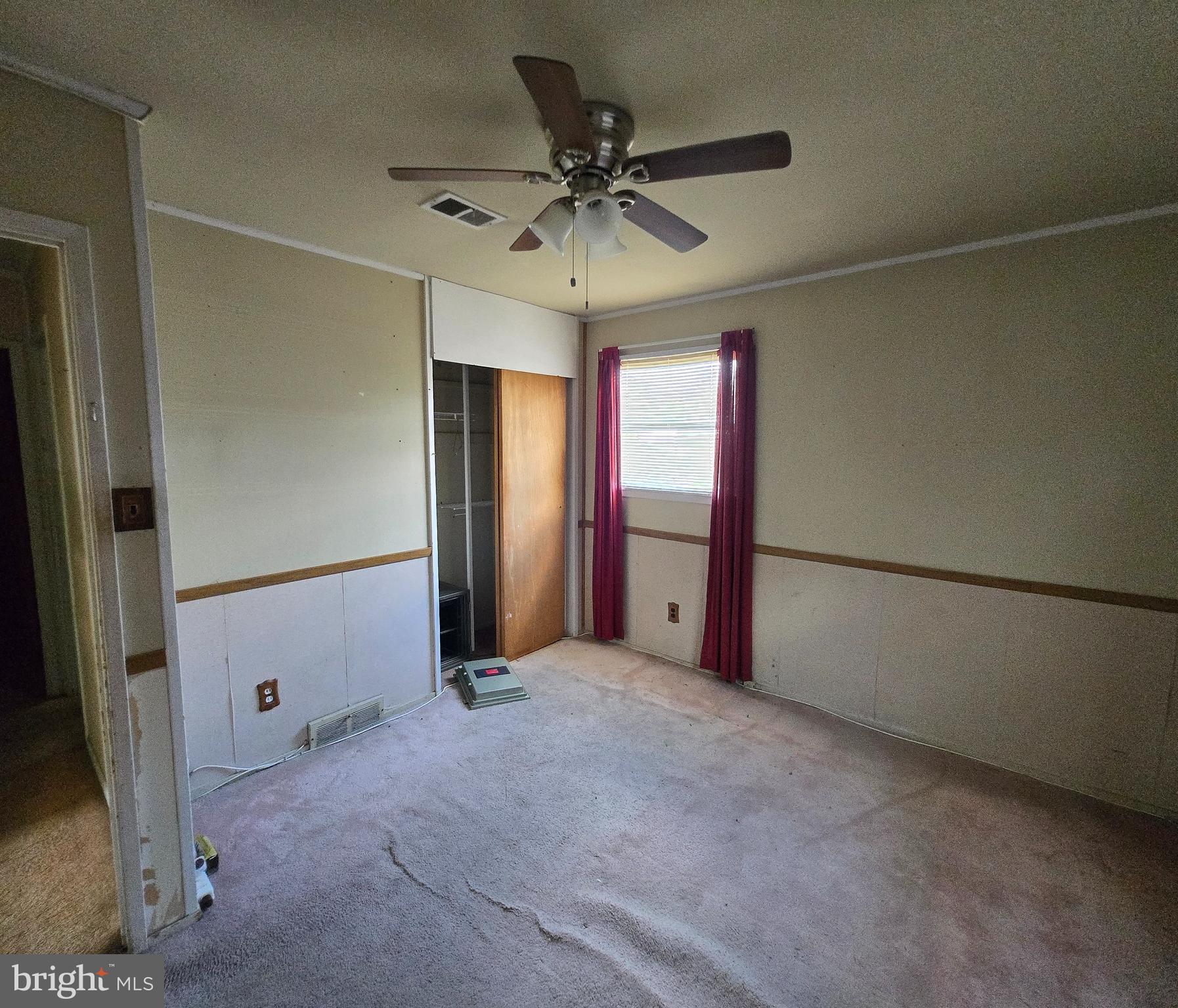 2434 Green Street Chester, PA 19013 - Photo 15 of 21 an empty room with window and a ceiling fan