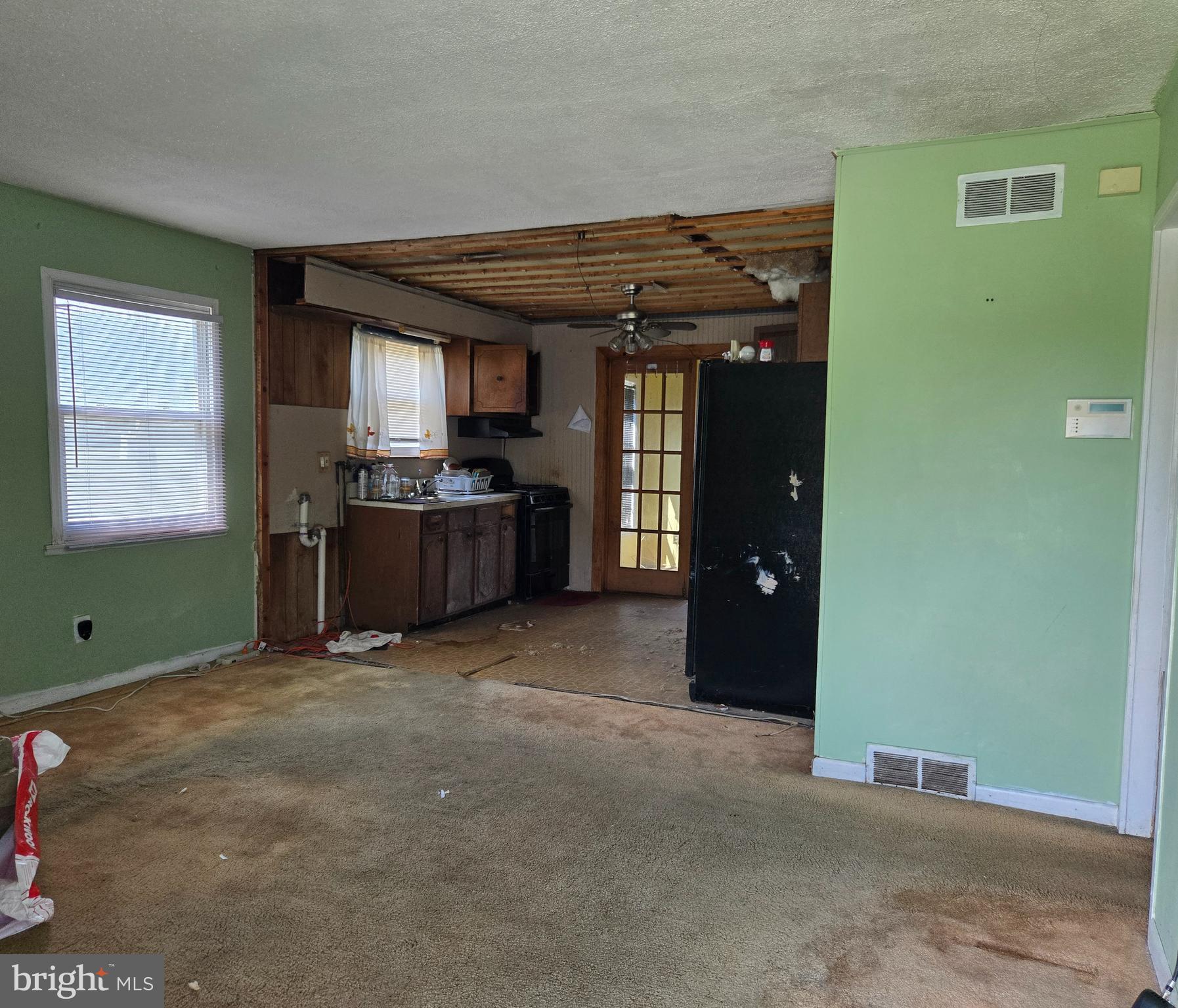 2434 Green Street Chester, PA 19013 - Photo 19 of 21 a view of an empty room with a fireplace and a window