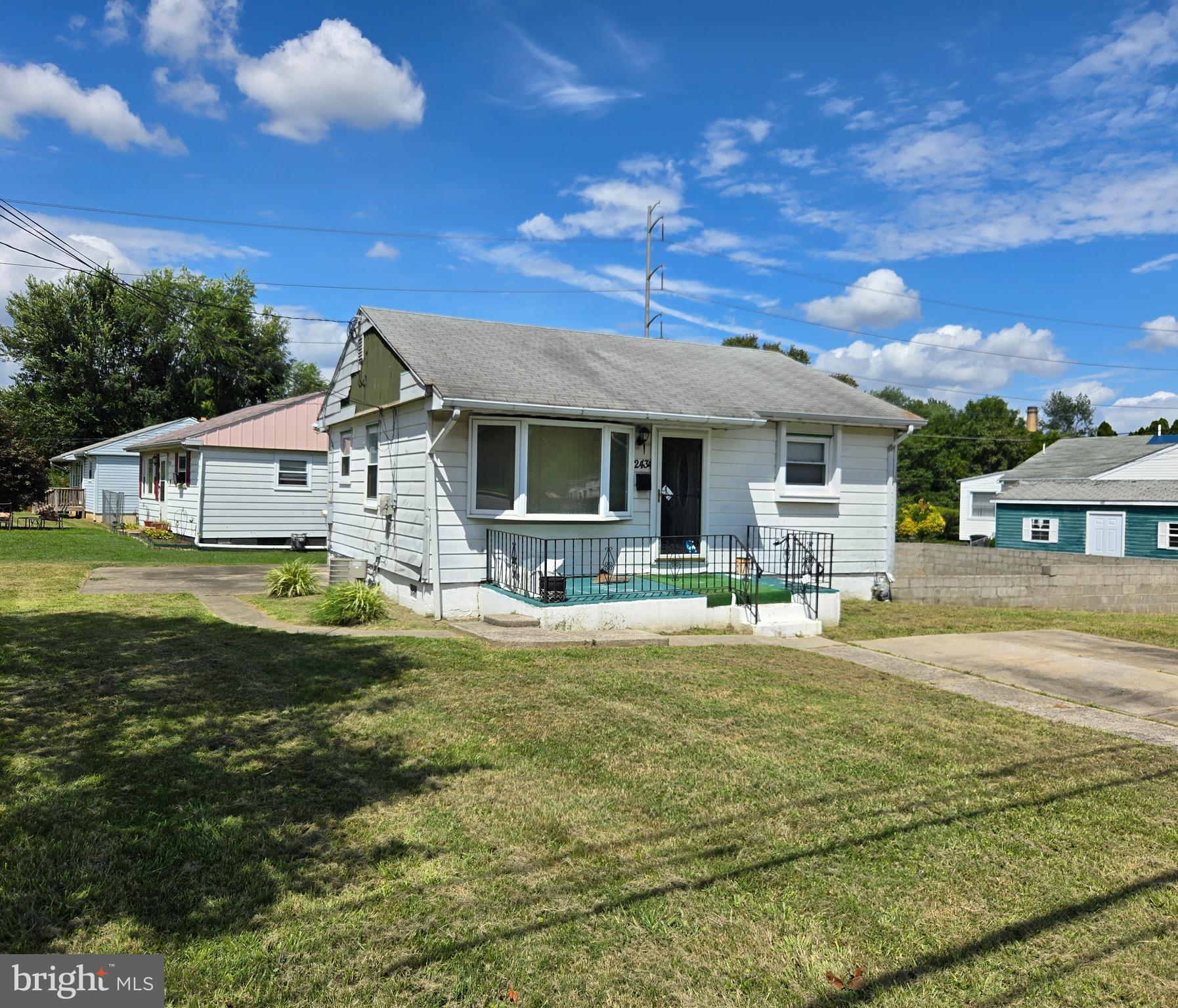 2434 Green Street Chester, PA 19013 - Photo 2 of 21 a front view of a house with a garden