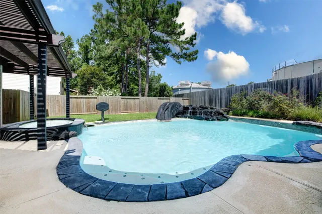 a view of a swimming pool with a sitting space