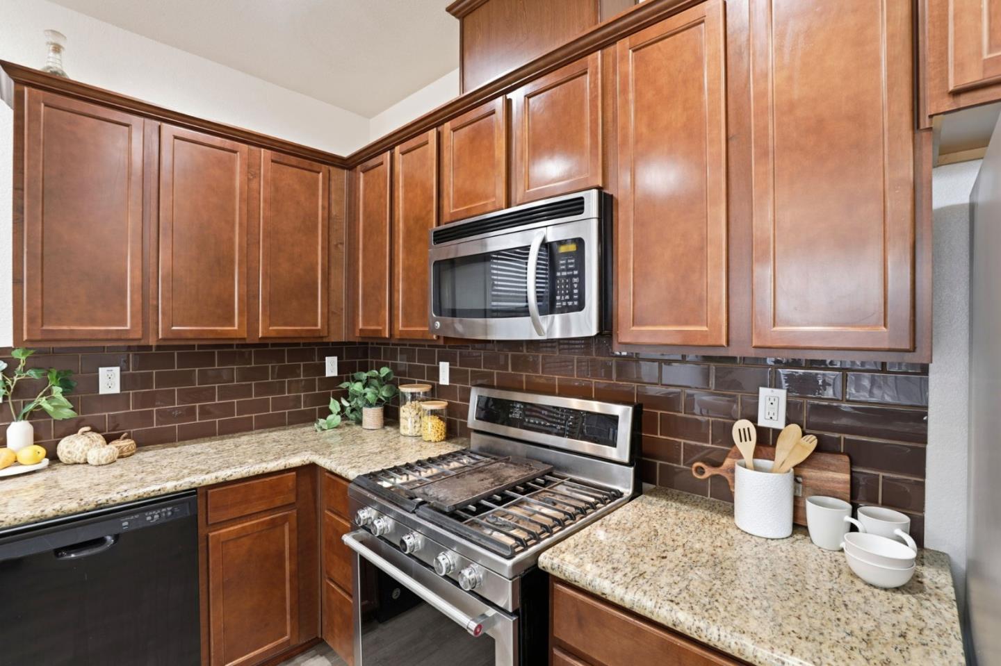 170 Sturla Way Gilroy, CA 95020 - Photo 12 of 64 a kitchen with a stove and a sink