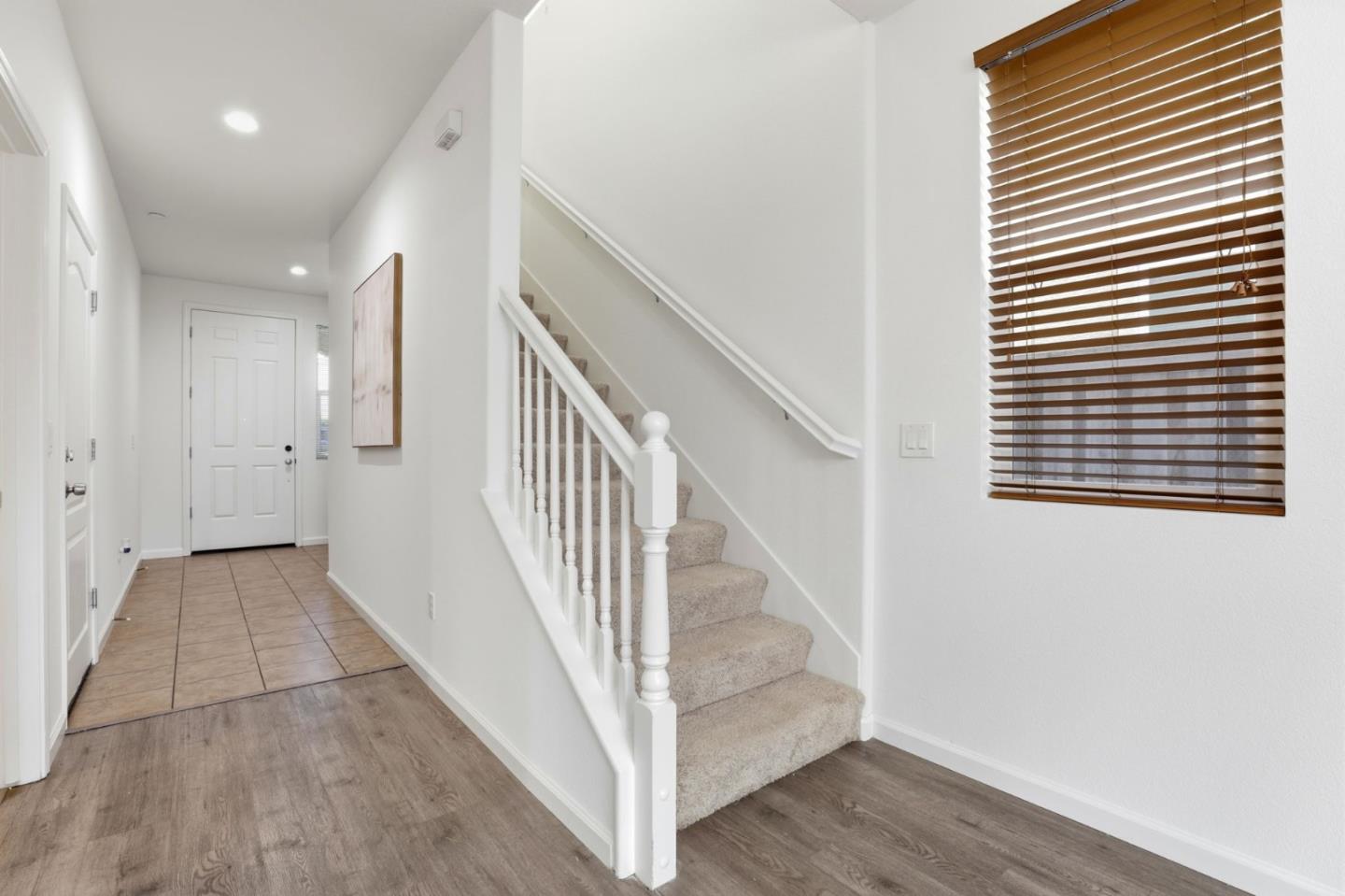 170 Sturla Way Gilroy, CA 95020 - Photo 19 of 64 a view of a hallway with wooden floor and entryway