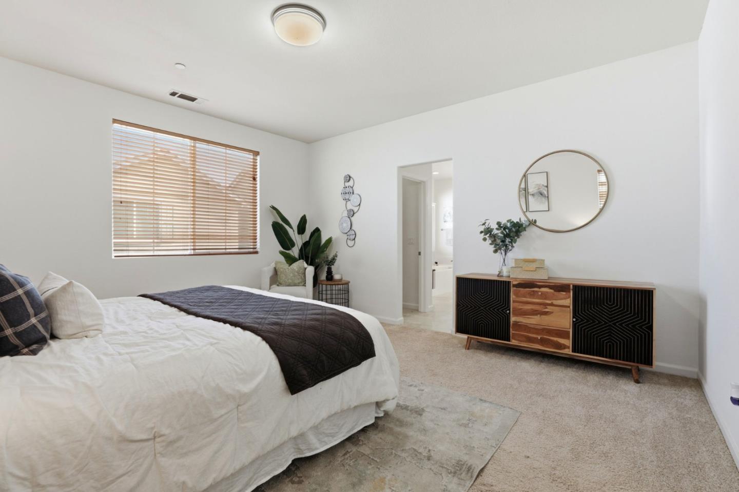 170 Sturla Way Gilroy, CA 95020 - Photo 21 of 64 a bedroom with a bed and windows